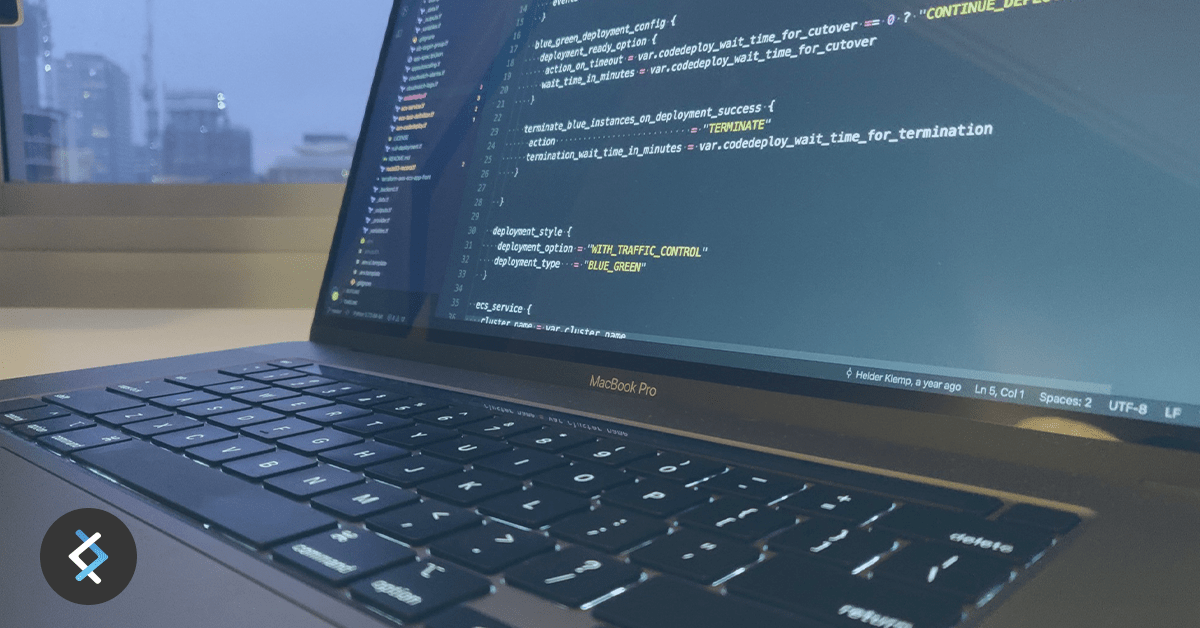 DNX Tech Update April-May-min Laptop with code on screen.