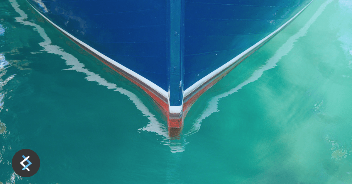 The bow of a boat on water
