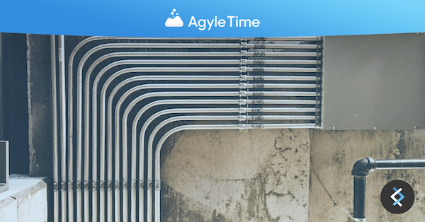 pipes against a wall, Agyle Time logo at top of image in front of a blue banner